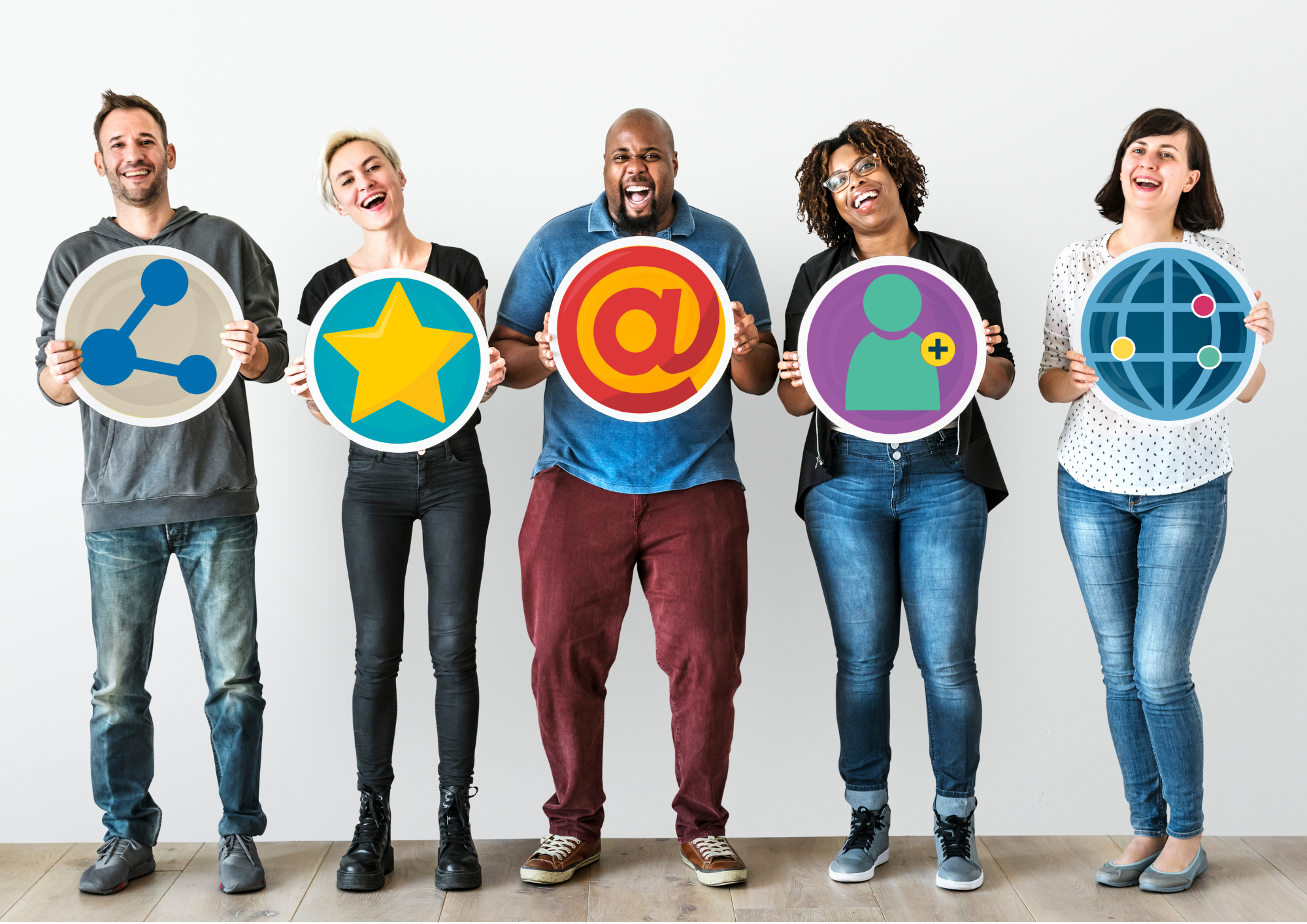 Image shows a team of people holding digital marketing signs