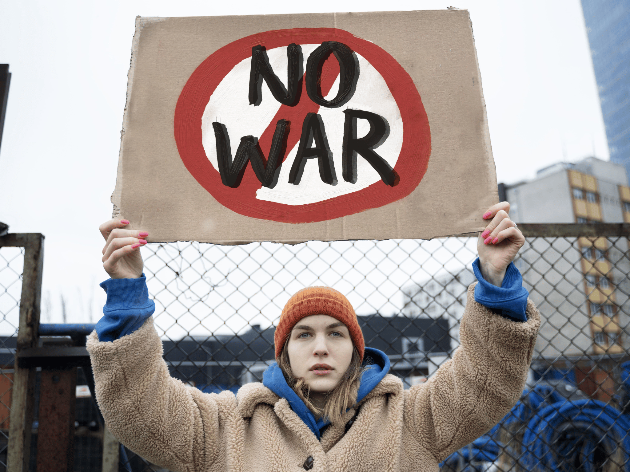 A man holding no war sign. Indicating world peace