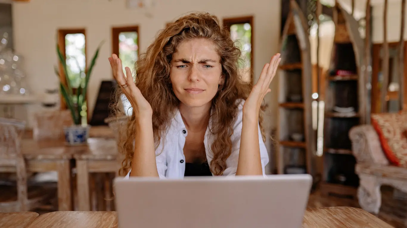 Female Business Owner looking frustrated because of Grok outage